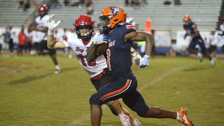 Escambia's Ladarian Clardy (1) runs with plenty of room in front of him on a punt return during Escambia's overtime victory over Bay on Friday, Sept. 13, 2024.
