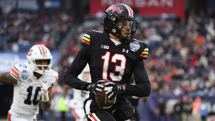 Dec 30, 2023; Nashville, TN, USA; Maryland Terrapins defensive back Glendon Miller (13) returns an interception for a touchdown during the second half against the Auburn Tigers at Nissan Stadium. Mandatory Credit: Christopher Hanewinckel-USA TODAY Sports