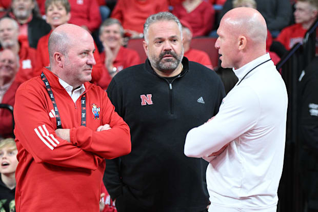 Nebraska Cornhuskers athletic director Troy Dannen, football coach Matt Rhule, and Matt Davidson meet before the game.