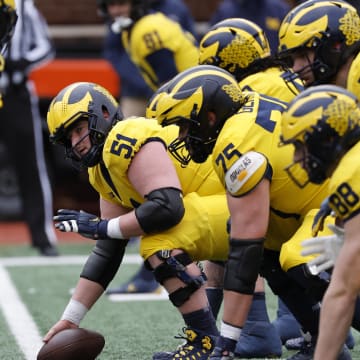 Apr 1, 2023; Ann Arbor, MI, USA; Michigan Wolverines offensive lineman Greg Crippen (51) prepares to snap during the Spring Game at Michigan Stadium. Mandatory Credit: Rick Osentoski-USA TODAY Sports