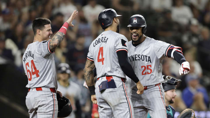 Minnesota Twins outfielder Byron Buxton (25) celebrates his three run home run with Minnesota Twins shortstop Carlos Correa (4) and Minnesota Twins third baseman Jose Miranda (64) during the sixth inning against the Seattle Mariners at T-Mobile Park on June 29.