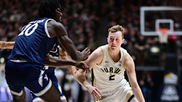 Purdue guard Fletcher Loyer (2) drives past Yale center Samson Aletan (10) during a game at Mackey Arena in November.