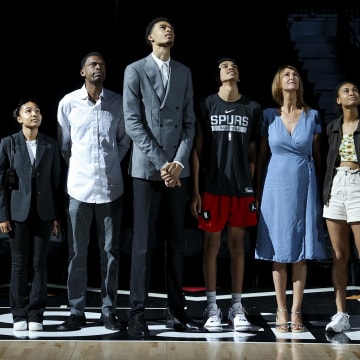 Jun 24, 2023; San Antonio, TX, USA; San Antonio Spurs draft pick Victor Wembanyama stands with family during a video presentation at a press conference at Frost Bank Center.
