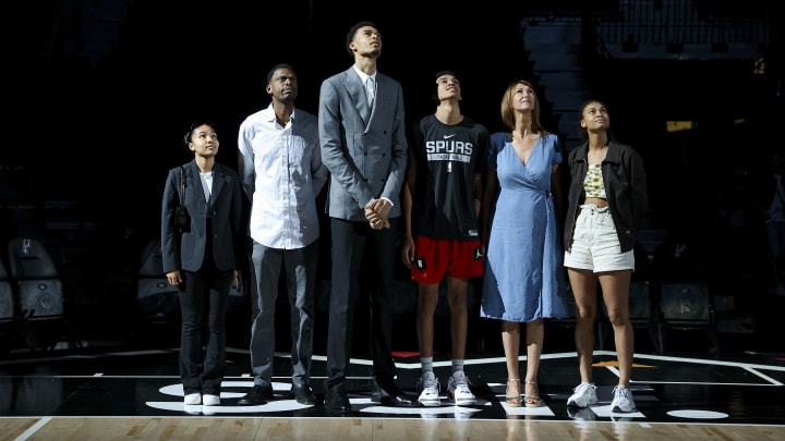 Jun 24, 2023; San Antonio, TX, USA; San Antonio Spurs draft pick Victor Wembanyama stands with family during a video presentation at a press conference at Frost Bank Center.