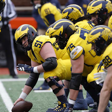 Apr 1, 2023; Ann Arbor, MI, USA; Michigan Wolverines offensive lineman Greg Crippen (51) prepares to snap during the Spring Game at Michigan Stadium. Mandatory Credit: Rick Osentoski-Imagn Images