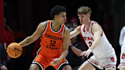 Jan 18, 2024; Salt Lake City, Utah, USA; Oregon State Beavers forward Michael Rataj (12) posts up on Utah Utes guard Cole Bajema (2) during the second half at Jon M. Huntsman Center. Mandatory Credit: Rob Gray-Imagn Images