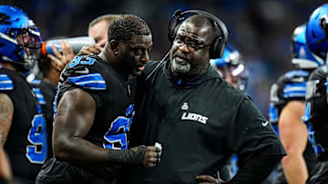 Detroit Lions defensive line coach Terrell Williams talks to defensive end Josh Paschal during the first half against Seattle Seahawks at Ford Field in Detroit on Monday, Sept. 30, 2024.