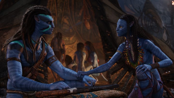 (L-R): Jake Sully (Sam Worthington) and Neytiri (Zoe Saldana) in 20th Century Studios' AVATAR: THE WAY OF WATER. Photo courtesy of 20th Century Studios. © 2022 20th Century Studios. All Rights Reserved.