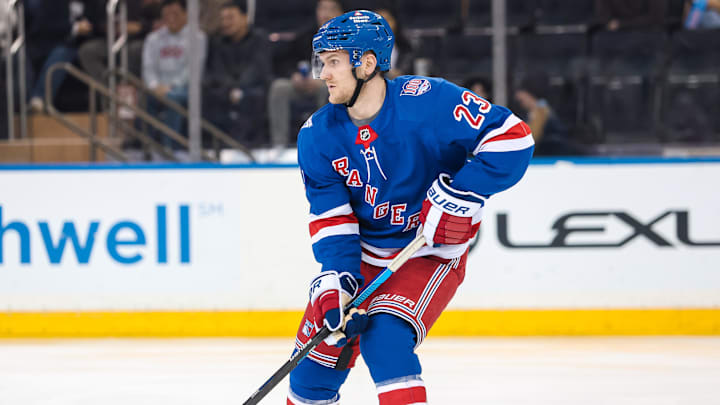 Apr 5, 2026; New York, New York, USA; New York Rangers defenseman Adam Fox (23) skates against the Washington Capitals during the second period at Madison Square Garden. 