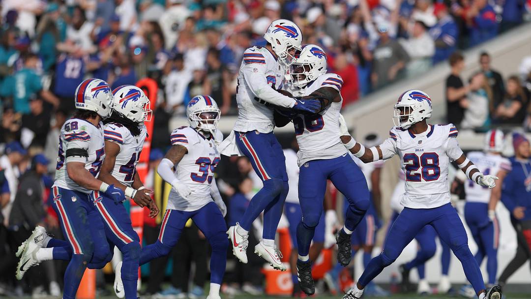 Jan 11, 2026; Jacksonville, FL, USA; Buffalo Bills safety Cole Bishop (24) and teammates react after catching an interception during the second half against the Jacksonville Jaguars in an AFC Wild Card Round game at EverBank Stadium. Mandatory Credit: Nathan Ray Seebeck-Imagn Images