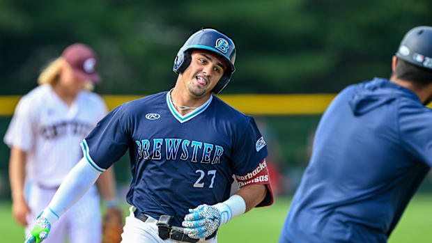 Ryder Helfrick of Brewster celebrates as he rounds third