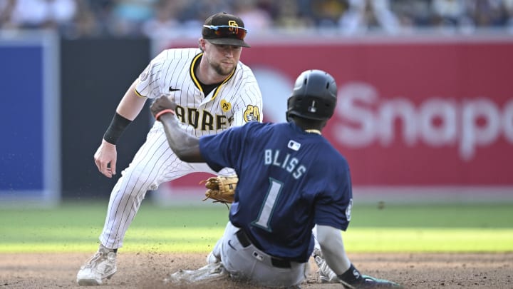 Seattle Mariners second baseman Ryan Bliss (1) is tagged out by San Diego Padres second baseman Jake Cronenworth on July 10 at Petco Park.