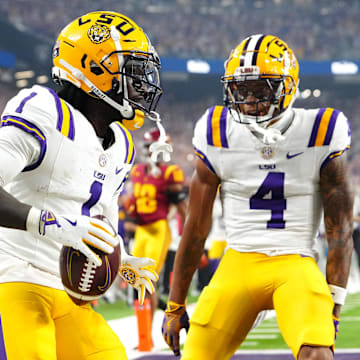 Sep 1, 2024; Paradise, Nevada, USA; LSU Tigers wide receiver Aaron Anderson (1) celebrates with wide receiver CJ Daniels (4) after scoring a touchdown against the Southern California Trojans during the third quarter at Allegiant Stadium. Mandatory Credit: Stephen R. Sylvanie-Imagn Images