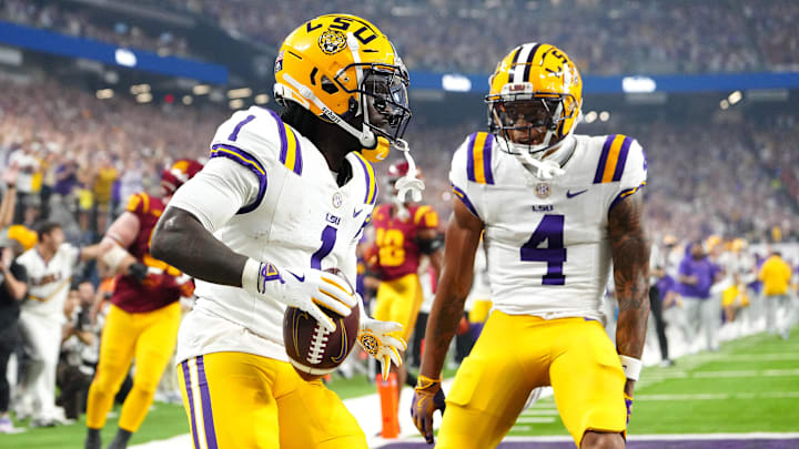 Sep 1, 2024; Paradise, Nevada, USA; LSU Tigers wide receiver Aaron Anderson (1) celebrates with wide receiver CJ Daniels (4) after scoring a touchdown against the Southern California Trojans during the third quarter at Allegiant Stadium. Mandatory Credit: Stephen R. Sylvanie-Imagn Images