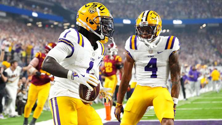 Sep 1, 2024; Paradise, Nevada, USA; LSU Tigers wide receiver Aaron Anderson (1) celebrates with wide receiver CJ Daniels (4) after scoring a touchdown against the Southern California Trojans during the third quarter at Allegiant Stadium. Mandatory Credit: Stephen R. Sylvanie-Imagn Images