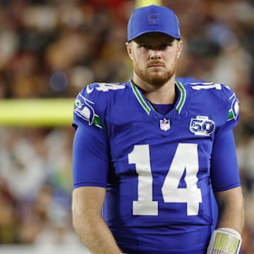 Nov 2, 2025; Landover, Maryland, USA; Seattle Seahawks quarterback Sam Darnold (14) looks on during the first half against the Washington Commanders at Northwest Stadium. Mandatory Credit: Amber Searls-Imagn Images