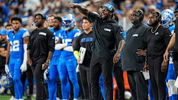 Detroit Lions linebackers coach Kelvin Sheppard signals players before a play against Los Angeles Rams during the second half at Ford Field in Detroit on Sunday, September 8, 2024.