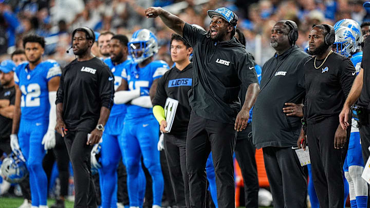 Detroit Lions linebackers coach Kelvin Sheppard signals players before a play against Los Angeles Rams during the second half at Ford Field in Detroit on Sunday, September 8, 2024.