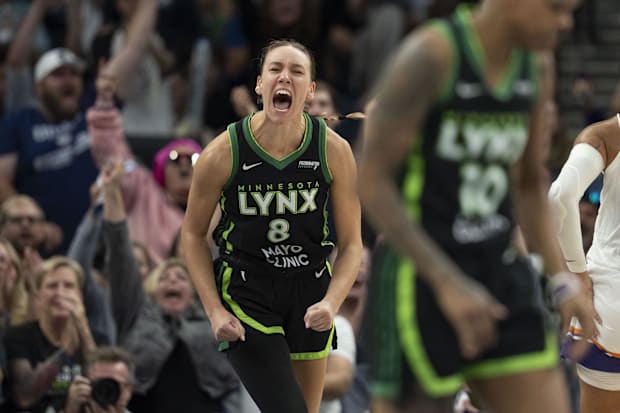 Minnesota Lynx forward Alanna Smith celebrates making a shot. 