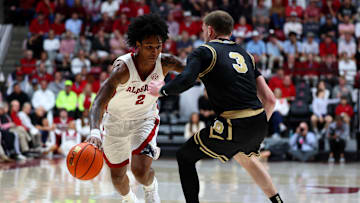 Nov 13, 2025; Tuscaloosa, Alabama, USA; Alabama Crimson Tide guard Aden Holloway (2) dribbles against Purdue Boilermakers guard Braden Smith (3) during the second half at Coleman Coliseum. Mandatory Credit: David Leong-Imagn Images