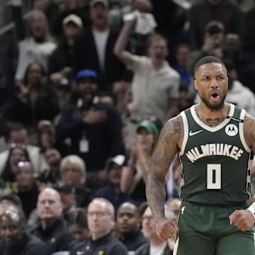 Apr 25, 2025; Milwaukee, Wisconsin, USA; Milwaukee Bucks guard Damian Lillard (0) reacts after making a basket against the Indiana Pacers in the second half during game three of first round for the 2024 NBA Playoffs at Fiserv Forum. Mandatory Credit: Michael McLoone-Imagn Images