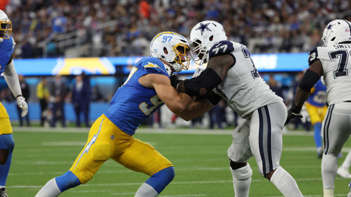 Oct 16, 2023; Inglewood, California, USA;  Los Angeles Chargers linebacker Joey Bosa (97) rushes against Dallas Cowboys offensive tackle Tyron Smith (77) during the third quarter at SoFi Stadium. Mandatory Credit: Kiyoshi Mio-USA TODAY Sports