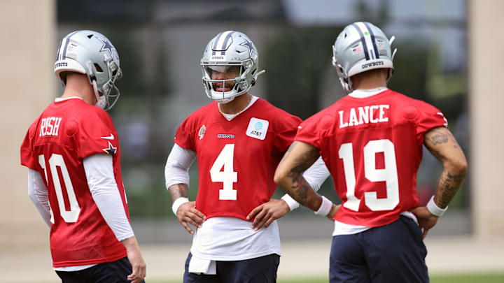 Cooper Rush, Dak Prescott and Trey Lance talk during training camp. All three would end up starting games for the Cowboys this season.