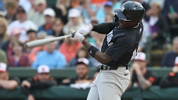 Mar 20, 2025; Sarasota, Florida, USA;  New York Yankees third base Jazz Chisholm Jr. (13) hits a two-RBI double during the first inning against the Baltimore Orioles at Ed Smith Stadium. Mandatory Credit: Kim Klement Neitzel-Imagn Images