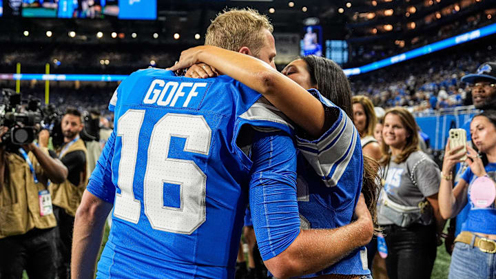 Detroit Lions quarterback Jared Goff hugs his wife Christen Harper during warmups before the Los Angeles Rams game.