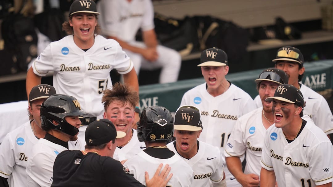 Wake Forest celebrates Javar Williams (14) 2-run home run at the NCAA college baseball Knoxville Regional final against Tennessee on June 1, 2025, in Knoxville, Tenn.