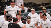 Wake Forest celebrates Javar Williams (14) 2-run home run at the NCAA college baseball Knoxville Regional final against Tennessee on June 1, 2025, in Knoxville, Tenn.