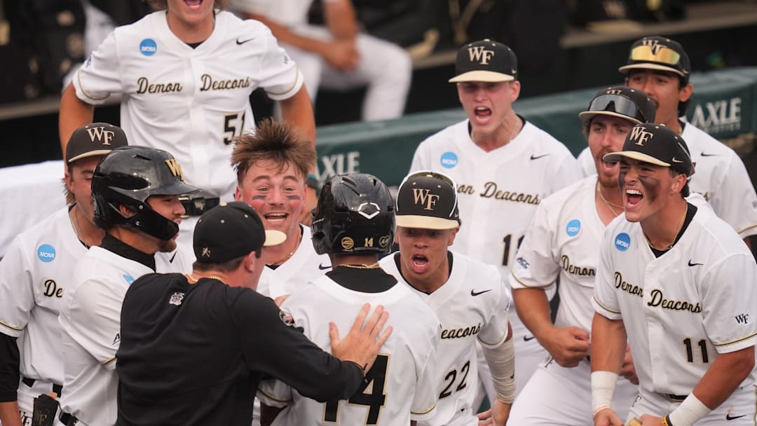 Wake Forest celebrates Javar Williams (14) 2-run home run at the NCAA college baseball Knoxville Regional final against Tennessee on June 1, 2025, in Knoxville, Tenn.