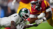 Sep 20, 2025; Los Angeles, California, USA; Southern California Trojans linebacker Desman Stephens II (23) moves in against Michigan State Spartans wide receiver Omari Kelly (1) during the first half at the Los Angeles Memorial Coliseum. Mandatory Credit: Gary A. Vasquez-Imagn Images