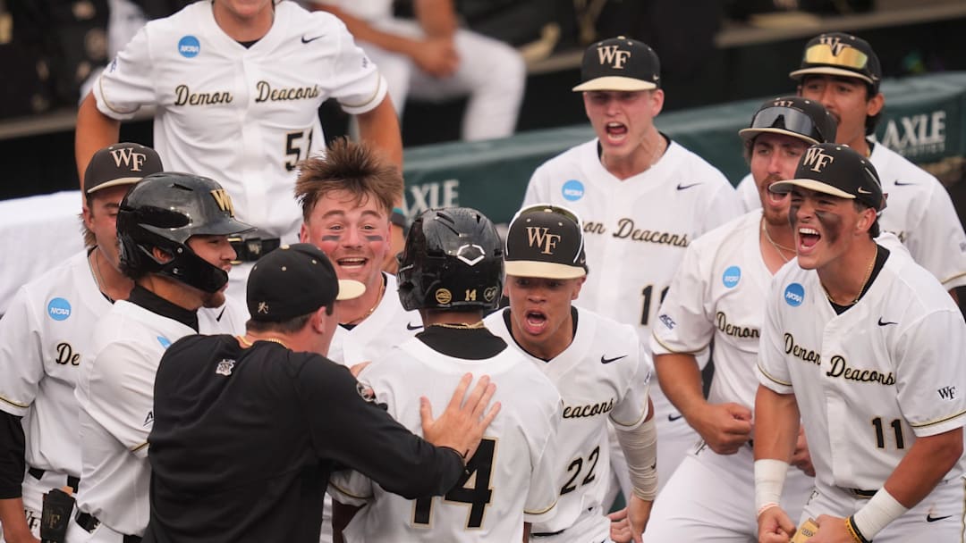 Wake Forest celebrates Javar Williams (14) 2-run home run at the NCAA college baseball Knoxville Regional final against Tennessee on June 1, 2025, in Knoxville, Tenn.