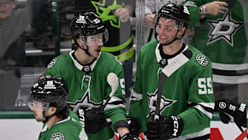 Jan 4, 2025; Dallas, Texas, USA; Dallas Stars center Wyatt Johnston (53) and defenseman Thomas Harley (55) celebrate on the ice after the Stars defeat the Utah Hockey Club in the overtime period at the American Airlines Center. Mandatory Credit: Jerome Miron-Imagn Images