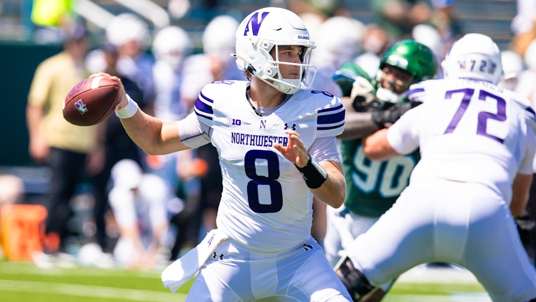 Aug 30, 2025; New Orleans, Louisiana, USA;  Northwestern Wildcats quarterback Preston Stone (8) passes against Tulane Green Wave during the second half at Yulman Stadium. Mandatory Credit: Stephen Lew-Imagn Images