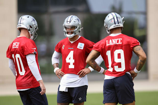 Dallas Cowboys quarterbacks Cooper Rush, Dak Prescott, and Trey Lance talk during practice at the Ford Center at The Star.