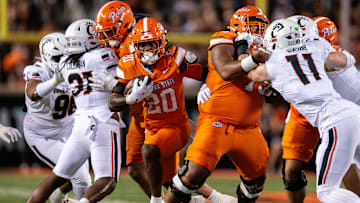 Oct 18, 2025; Stillwater, Oklahoma, USA; Oklahoma State Cowboys running back Rodney Fields Jr. (20) runs the ball during the first half against the Cincinnati Bearcats at Boone Pickens Stadium. Mandatory Credit: William Purnell-Imagn Images