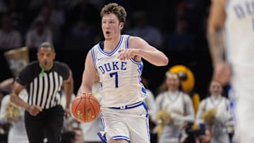 Mar 13, 2025; Charlotte, NC, USA; Duke Blue Devils guard Kon Knueppel (7) brings the ball up court against the Georgia Tech Yellow Jackets during the second half at Spectrum Center. Mandatory Credit: Jim Dedmon-Imagn Images