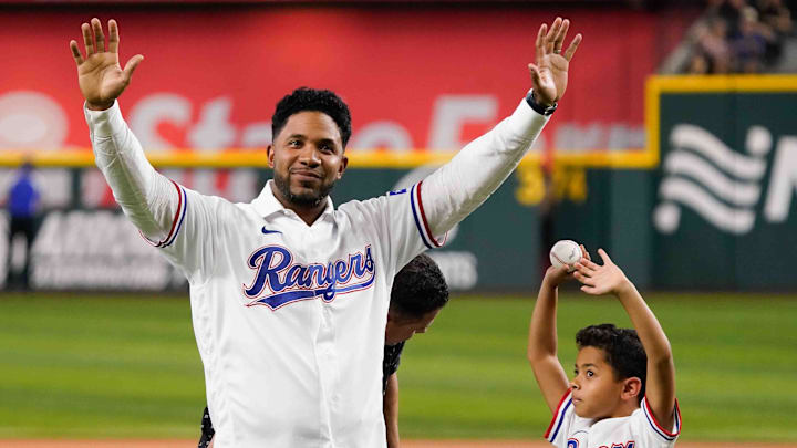 Sep 6, 2024; Arlington, Texas, USA; Former Texas Ranger Elvis Andres waves to fans after his son Elvis threw out the first pitch before the game between the Texas Rangers and the Los Angeles Angels at Globe Life Field. Andrus retired as a Texas Ranger after playing the first 12 seasons of his 15-year Major League career in Arlington. 