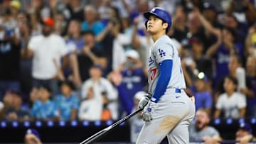 Sep 19, 2024; Miami, Florida, USA; Los Angeles Dodgers designated hitter Shohei Ohtani (17) watches his two-run home run against the Miami Marlins during the seventh inning at loanDepot Park. Mandatory Credit: Sam Navarro-Imagn Images