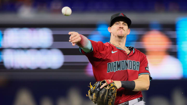 Aug 20, 2024; Miami, Florida, USA; Arizona Diamondbacks second baseman Kevin Newman (18) throws to first base to retire second baseman Vidal Brujan (not pictured) during the ninth inning at loanDepot Park. Mandatory Credit: Sam Navarro-USA TODAY Sports