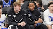 Mar 14, 2025; Charlotte, NC, USA; Duke Blue Devils forward Cooper Flagg (2) and forward Maliq Brown (6) on the bench during the first half against the North Carolina Tar Heels at Spectrum Center. 