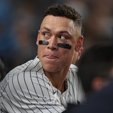 Sep 13, 2024; Bronx, New York, USA; New York Yankees center fielder Aaron Judge (99) looks back from the dug out during the third inning against the Boston Red Sox at Yankee Stadium. Mandatory Credit: Vincent Carchietta-Imagn Images