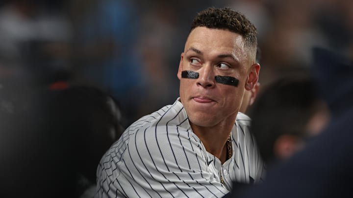 Sep 13, 2024; Bronx, New York, USA; New York Yankees center fielder Aaron Judge (99) looks back from the dug out during the third inning against the Boston Red Sox at Yankee Stadium. Mandatory Credit: Vincent Carchietta-Imagn Images