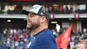 Sep 28, 2025; Cleveland, Ohio, USA;  Cleveland Guardians manager Stephen Vogt (12) watches the flag raising after the Guardians beat the Texas Rangers and won the American League Central Division at Progressive Field. Mandatory Credit: Ken Blaze-Imagn Images