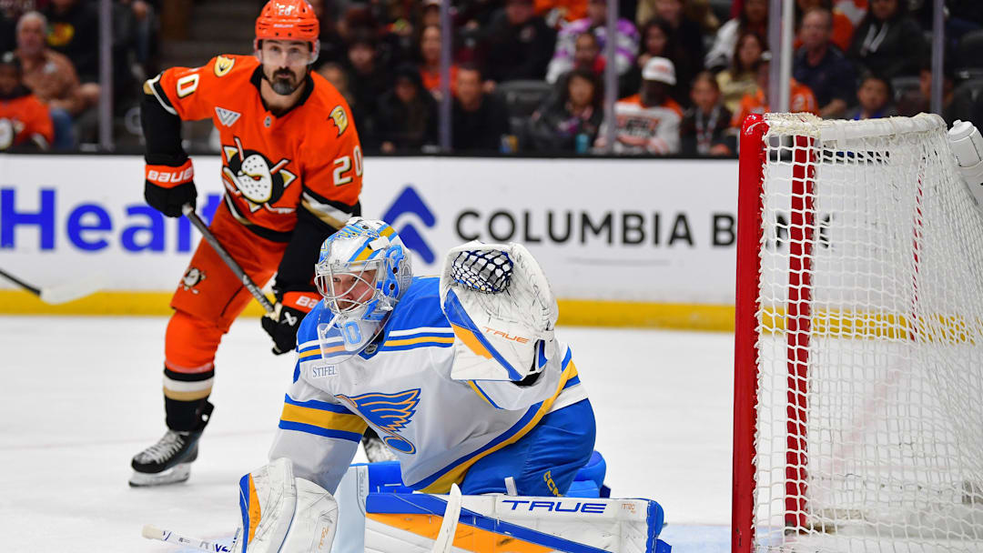 Apr 3, 2026; Anaheim, California, USA; St. Louis Blues goaltender Joel Hofer (30) defends the goal as Anaheim Ducks left wing Chris Kreider (20) is in position during the second period at Honda Center. Mandatory Credit: Gary A. Vasquez-Imagn Images