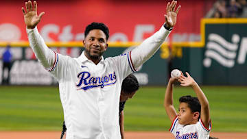 Sep 6, 2024; Arlington, Texas, USA; Former Texas Ranger Elvis Andres waves to fans after his son Elvis threw out the first pitch before the game between the Texas Rangers and the Los Angeles Angels at Globe Life Field. Andrus retired as a Texas Ranger after playing the first 12 seasons of his 15-year Major League career in Arlington.