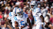 Ole Miss running back Kewan Lacy (5) celebrates with Ole Miss wide receiver Deuce Alexander (11) after scoring a touchdown during a college football game between Mississippi State and Ole Miss at Davis Wade Stadium in Starkville, Miss., on Friday, Nov. 28, 2025. The Egg Bowl game marks the 122nd meeting between the two teams.