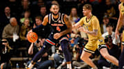 Feb 11, 2025; Nashville, Tennessee, USA;  Auburn Tigers forward Johni Broome (4) backs down Vanderbilt Commodores guard Tyler Nickel (5)] during the first half at Memorial Gymnasium. Mandatory Credit: Steve Roberts-Imagn Images